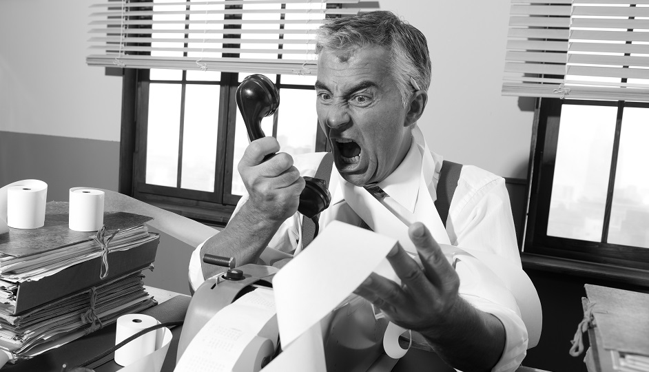 Angry vintage businessman shouting at phone